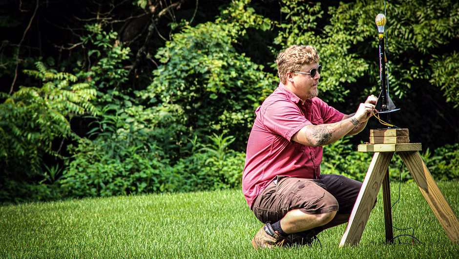 A club member preparing a rocket